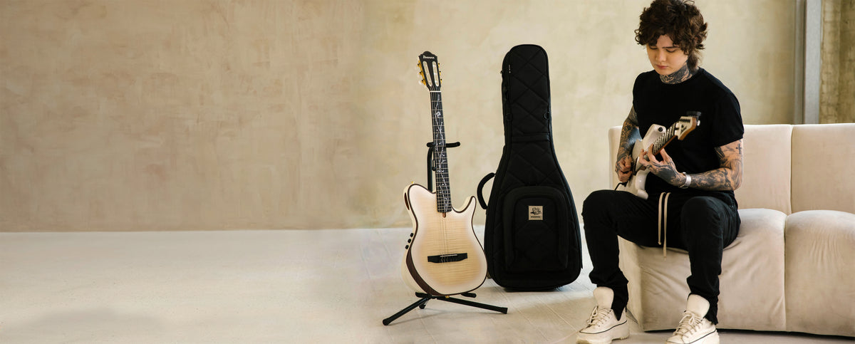 Tim Henson playing guitar next to the MONO x Tim Henson M80 Classic Dual Electric Guitar Case | MONO Australia